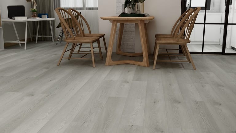 Silver-gray SPC floor beneath a wooden dining set
