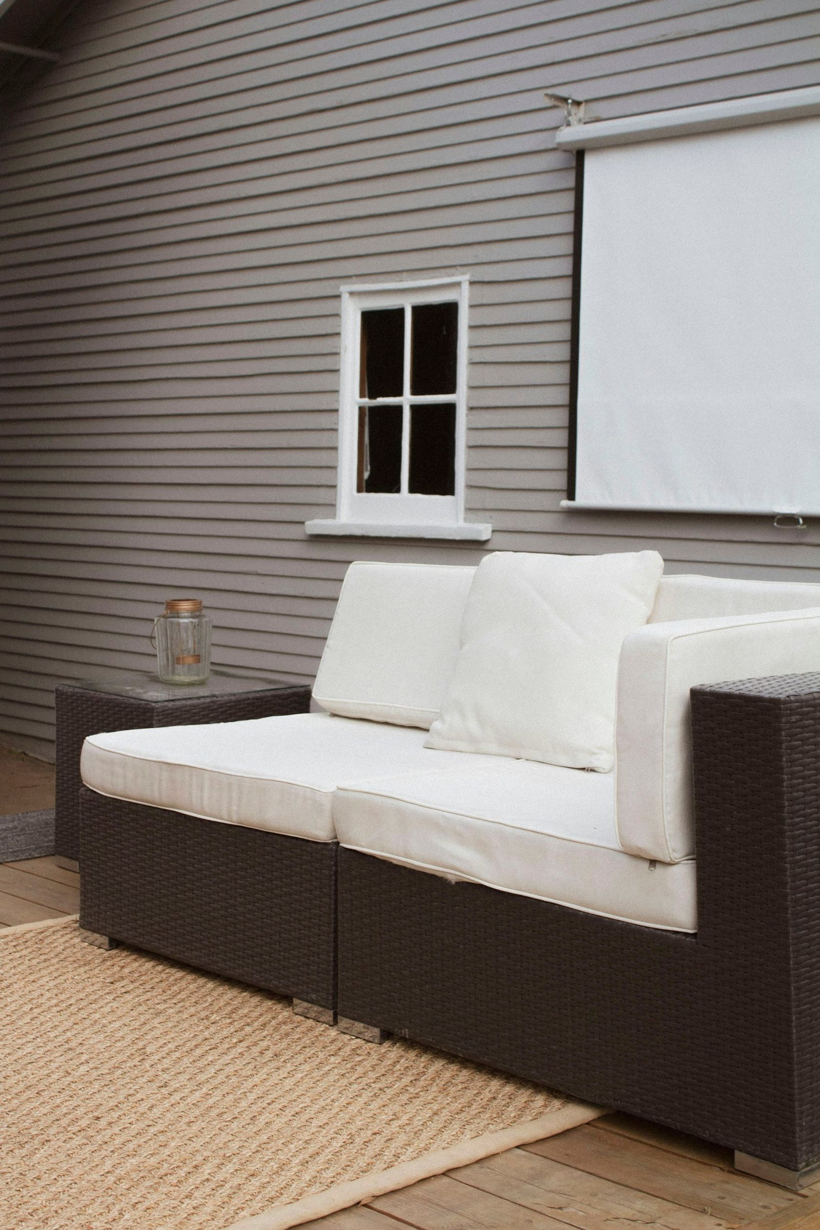 Evening deck lounge with composite cladding and warm lighting