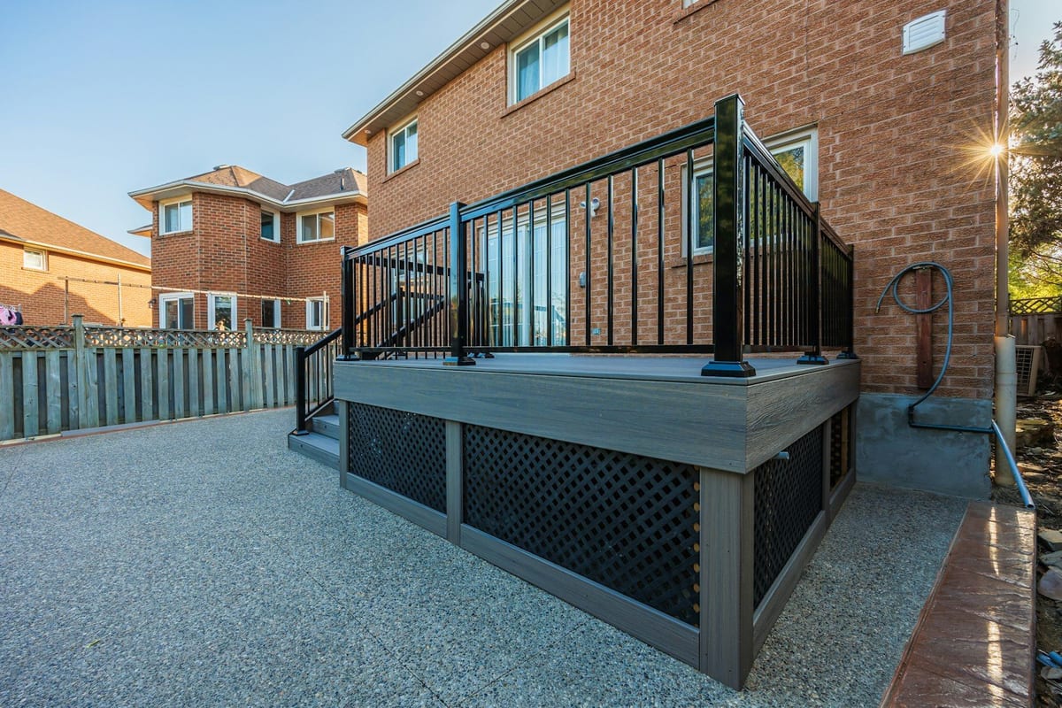 Raised composite deck with railing